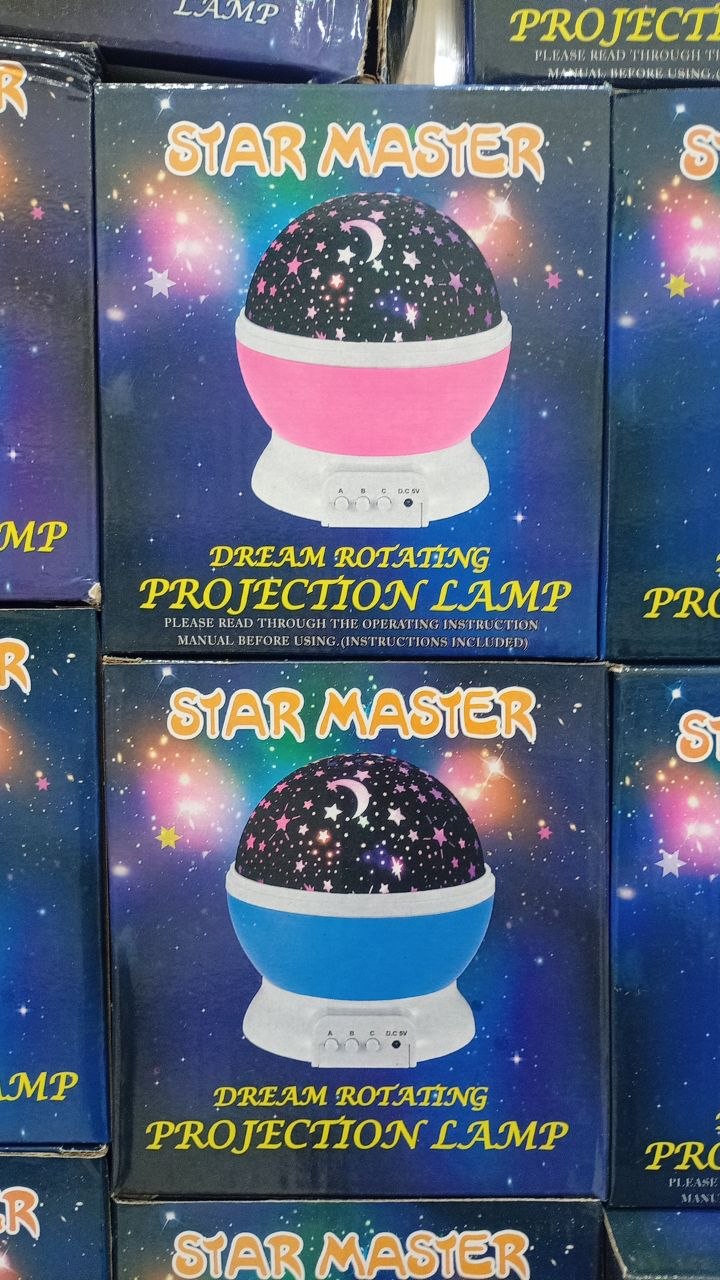 چراغ خواب چرخشی ماه و ستاره مدل Star Master با نور LED